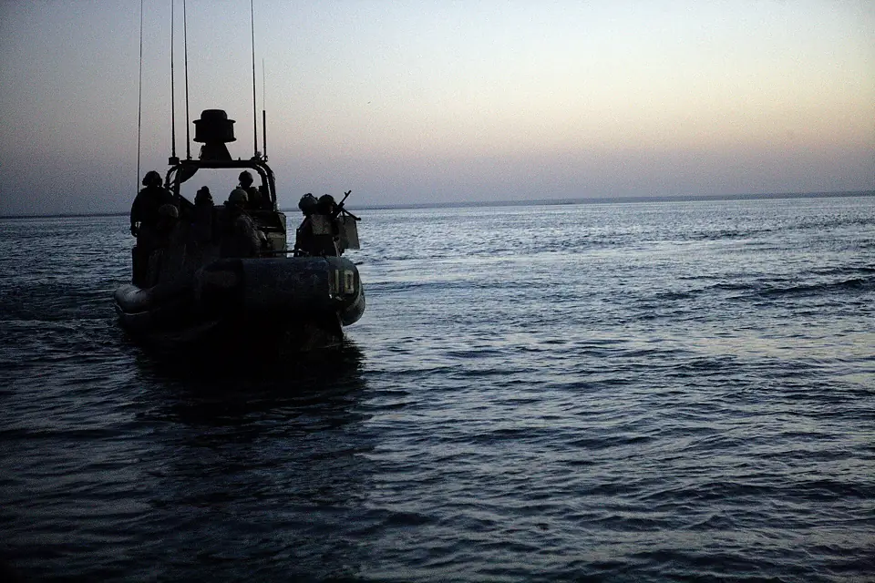 US Navy 080711-M-1391M-007 Sailors assigned to Riverine Squadron (RIVRON) 3 coast through Lake Quadsiyah on a Riverine patrol boat near Haditha