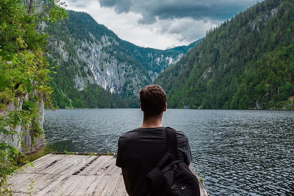 Man on a lake platform (Unsplash)