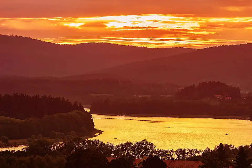 Colorful idyllic sunset landscape at lake Lipno